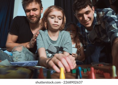      Staged photo  Homosexual couple   their children  two cute girls  at home   Everybody plays and delight  Okay  girl  let's see what you got                       