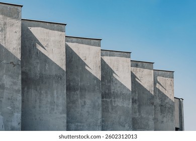 Staggered Concrete Facade with Dramatic Angular Shadows