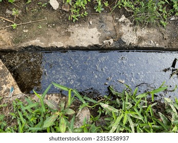 Stagnant water channels and very dirty black fibers - Shutterstock ID 2315258937