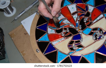 Stain Glass: burnishing the sections of a project.