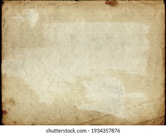 Stained, dirty, and distressed cream white, brown, orange, and tan vintage paper texture. Folded and faded, torn, ripped, peeling and creased from old age.  - Shutterstock ID 1934357876
