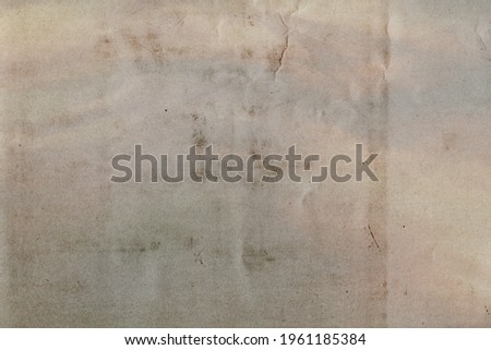 Stained, faded, torn, cracked, scratched, dirty, and distressed paper texture. Subtle gradient coloring and halftone pattern. Lighter spots on right side are from fading and decay over time.
