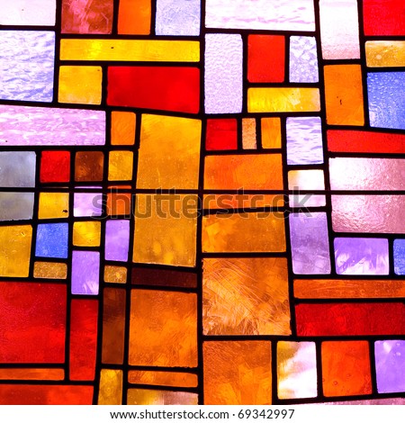 Stained glass church window in a reddish tone, square orientation