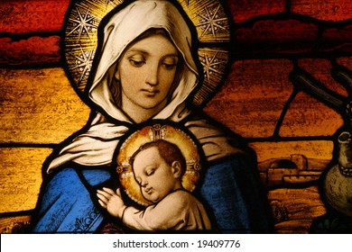 Stained glass depicting the Virgin Mary holding baby Jesus