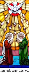 Stained Glass image of the Pentecost taken at St Elizabeth Seton Catholic Church in Ocean Springs, MS. On November 11, 2018