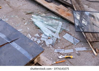 Stained Glass Shards And Waste In A Glass Studio Container. The Hot Glass Is Cut With Special Scissors Into The Vessels, Where It Burns And Cracks