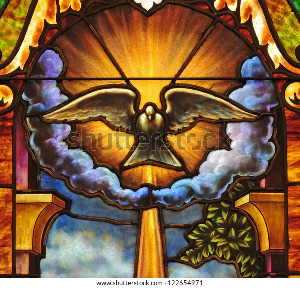 Stained glass window depicting the Holy Spirit in the form of a dove