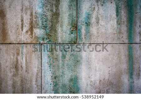 Stained limestone stone wall grungey background.