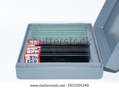 Stained and unstained slides stack into the slide box, microbiological experiment
