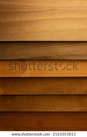 Stained wood panel samples in various shades on of brown. Color and finishing samples. 