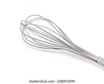 Stainless egg beater to whisk eggs isolated on white.