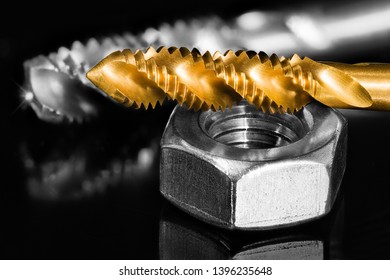 Stainless Nut. Steel Tap Drill Coated By Titanium. Artistic Detail. Spiral Fluted Cutting Tools For Tapping. Reflection On Black And White Shiny Background. Threaded Hole. Chip Machining, Metal Work.