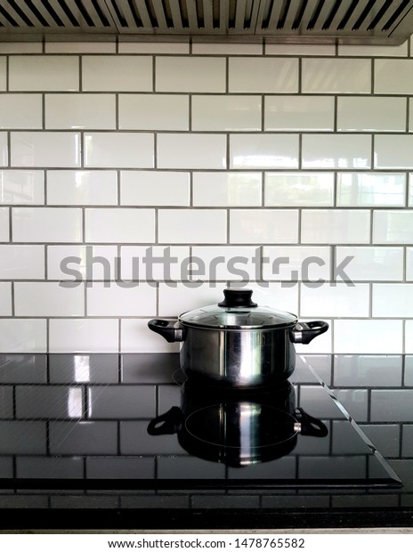 Stainless Pot On Modern Black Induction Stock Photo Edit Now