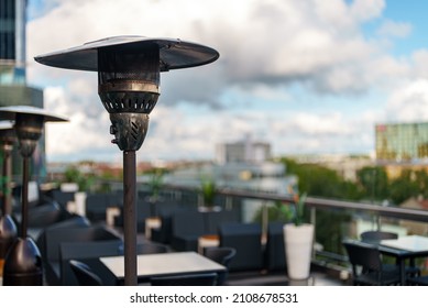 Stainless Stand Up Outdoor Gas Heater In Cafe.