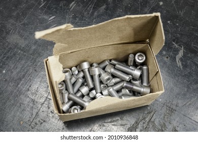 Stainless Steel Allen Screws In A Paper Box.