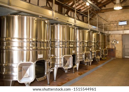 Stainless steel aluminium tanks with controlled cooling system at the winery