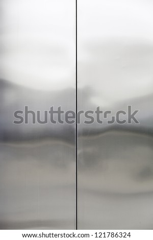Stainless steel, closed metal door detail, interior