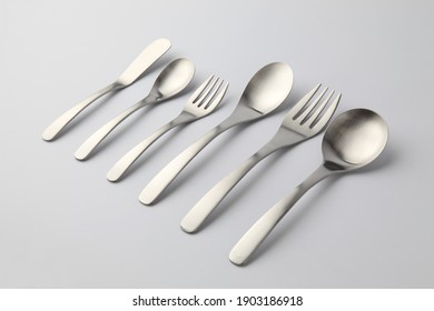 stainless steel cutlery sppons forks knife isolated on white background