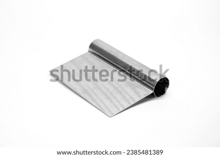 Stainless steel cutter isolated on white background. Stainless steel dough scraper