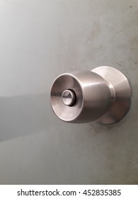 Stainless Steel Door Knob On The Door Background 