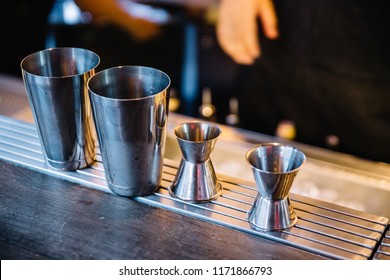 Stainless steel double-side cocktail jigger measure cup and shaker for making cocktails.