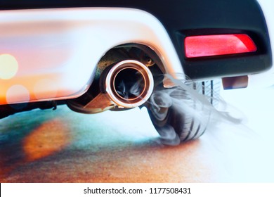 Stainless steel exhaust pipes on a silver car - Shutterstock ID 1177508431