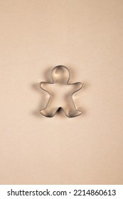 Stainless Steel Gingerbread Man Cookie Cutter On A Beige Background