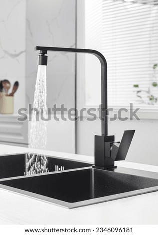 Stainless steel kitchen faucet, indoor kitchen scene, gradient color background, stereo photography light