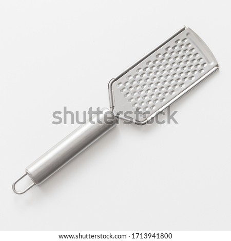 Stainless steel kitchen grater isolated on white background