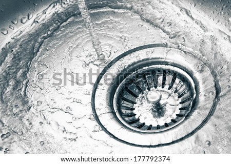 a stainless steel kitchen sink drain