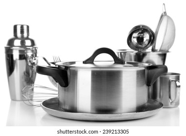 Stainless steel kitchenware on table, isolated on white - Shutterstock ID 239213305