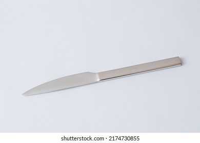 Stainless Steel Knife On White Background, Table Knife, Copy Space.