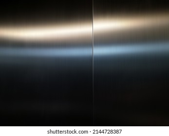 Stainless steel large sheet  With light hitting the surface  For background,Inside passenger elevator,Reflection of light on a shiny metal texture,stainless steel background. - Shutterstock ID 2144728387