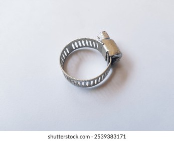 Stainless Steel Metal Hose Clamp isolated on a white background. Ideal tool for plumbers, construction workers and household repairing, gas or water hose clamp tool - Powered by Shutterstock