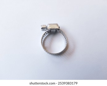 Stainless Steel Metal Hose Clamp isolated on a white background. Ideal tool for plumbers, construction workers and household repairing, gas or water hose clamp tool - Powered by Shutterstock