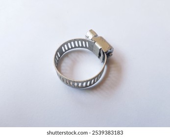 Stainless Steel Metal Hose Clamp isolated on a white background. Ideal tool for plumbers, construction workers and household repairing, gas or water hose clamp tool - Powered by Shutterstock