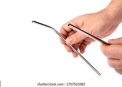 Stainless Steel Metal Straw In Hand On A White Isolated Background. Showing Subject On A White Background.