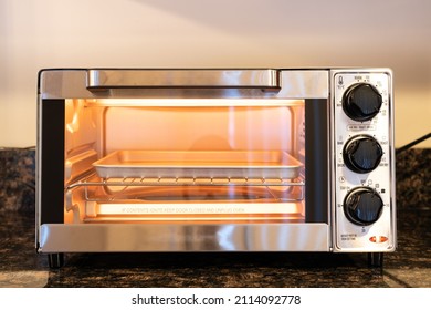 Stainless Steel Modern Design Toaster Oven Is On The Granite Kitchen Countertop