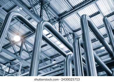 Stainless steel pipes in food or pharmaceutical or chemical industrial factory, industrial concept background