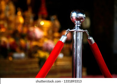 Stainless steel pole and red rope For blocking the area, stainless steel barrier posts security stanchion rope. - Shutterstock ID 1331893313