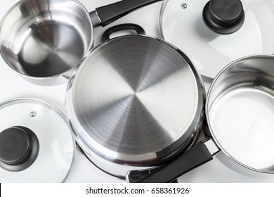 Stainless Steel Pots And Pans Isolated On White