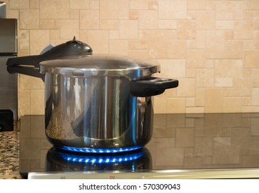 Stainless Steel Pressure Cooker On Hob