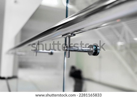 stainless steel railings and glass wall in modern building interior