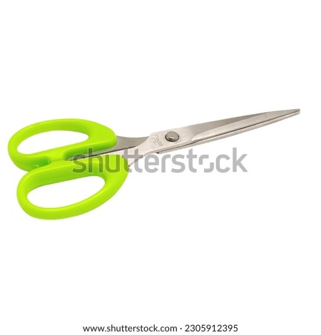 Stainless steel scissor with green handle isolated on white background


