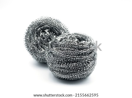 Stainless steel scrubber, scouring pad (metal sponge, scrub bud) for dish washing isolated on white background.