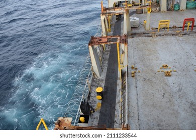 Stainless Steel Sharp Barbed Wire Or Razor Wire Attached To The Ship Hull, Superstructure And Railings To Protect The Crew Against Piracy Attack Passing Gulf Of Guinea In West Africa. Areal View. 