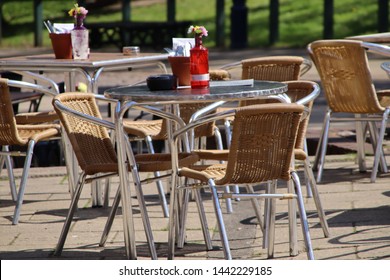 Stainless Steel Table And Chairs Outside A Cafe For Al Fresco Dining.