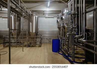 Stainless steel vats for fermentation in modern craft brewery. - Powered by Shutterstock