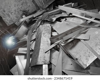 Stainless and Steel waste in junk yard,rust and damaged metal parts,prepare for recycle,Lens flare effect