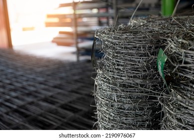 Stainless Steel Wire Rolls In Construction Site. Closeup Of Metal Steel Reinforcement Rod For Concrete In Store.Wire Mesh Places On Floor Ground. Construction Site Concept.